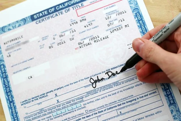 Arizona vehicle title document with signature