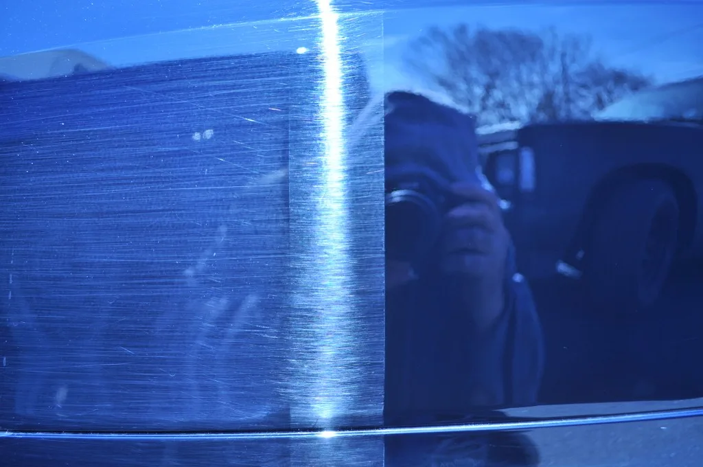 BMW scratched mirror housing car wash damage