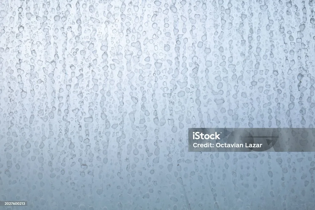 hard water mineral deposits on glass