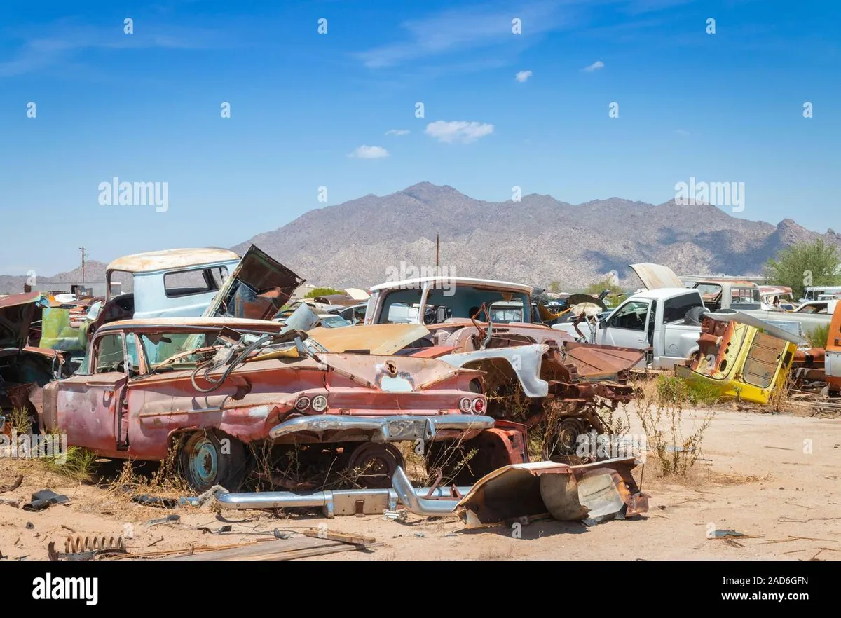 junk car on vacant commercial lot