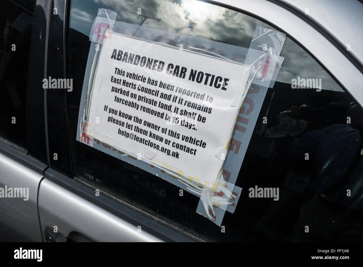 notification notice posted on abandoned vehicle