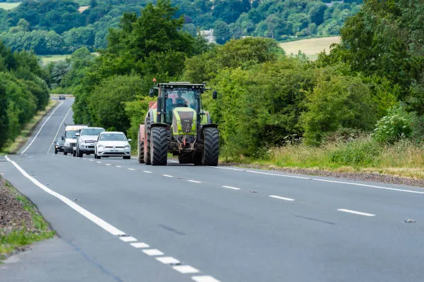 slow moving farm vehicle road