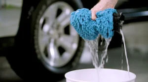 washing a car using a bucket