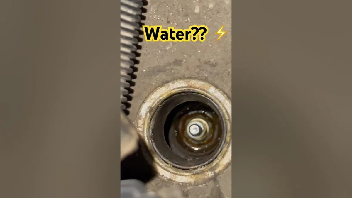 water damage to spark plug well