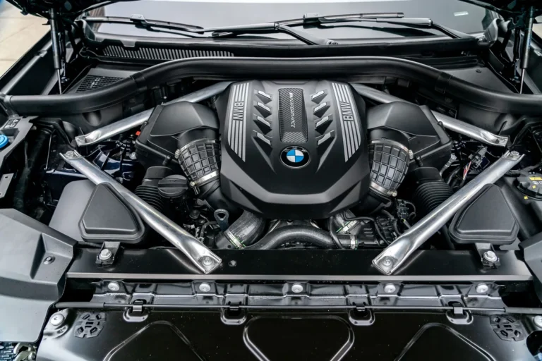 2020 BMW X5 engine bay auxiliary battery location