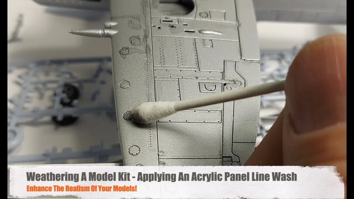 applying black wash to model