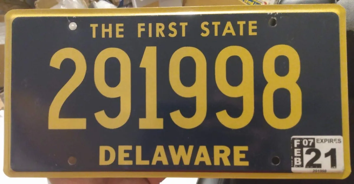 Delaware license plate with address sticker