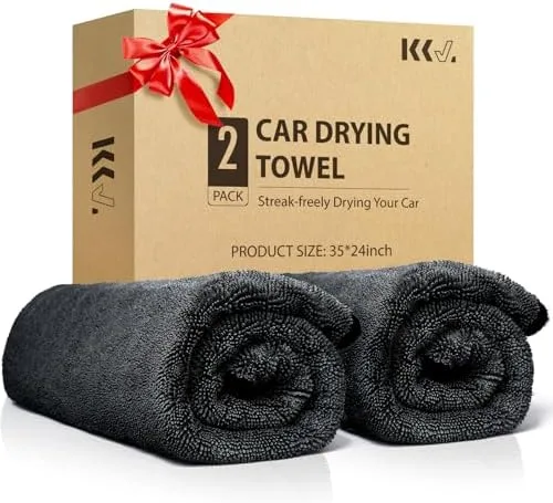 drying black car with microfiber towel