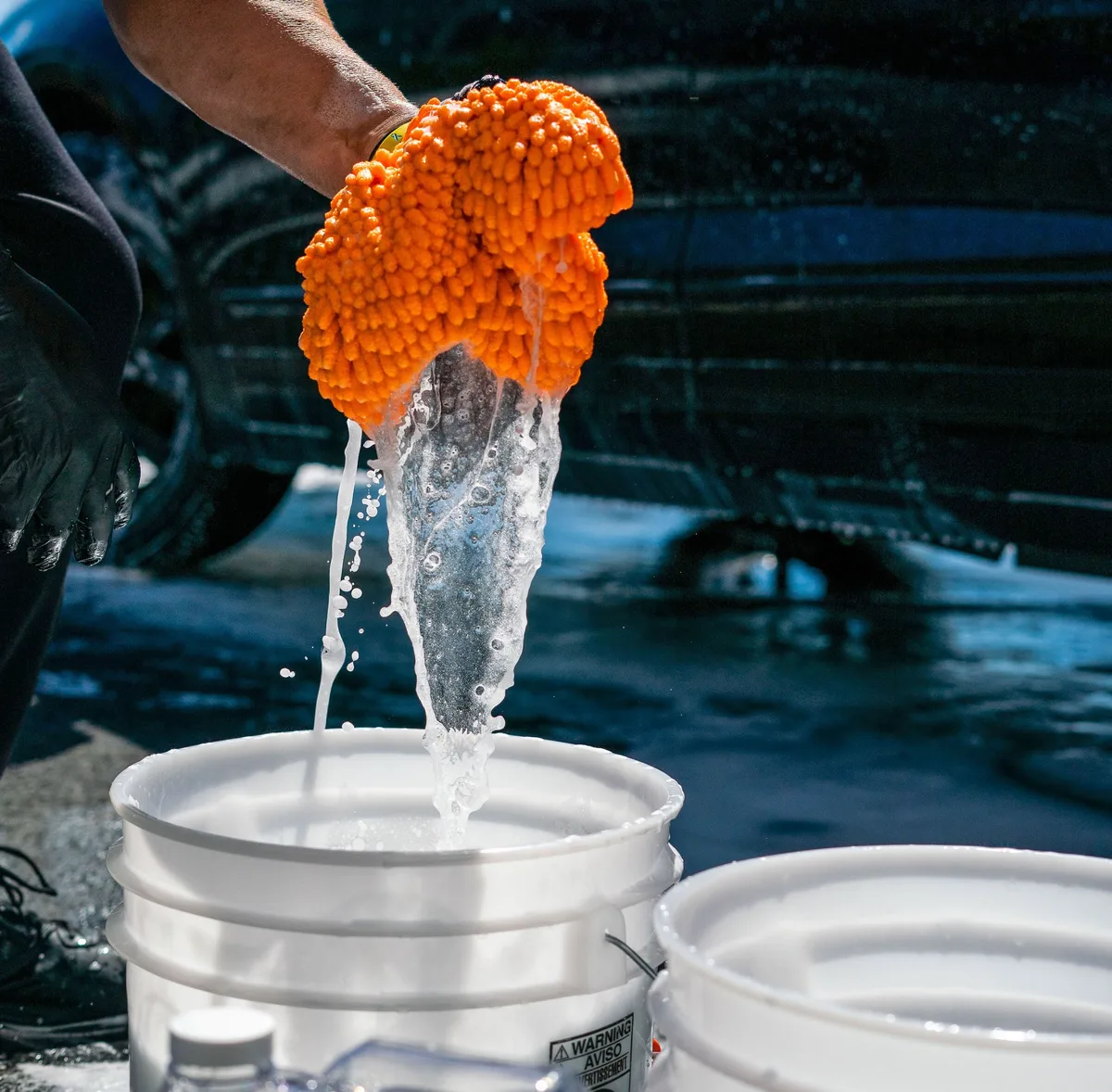 hand washing car with two bucket method
