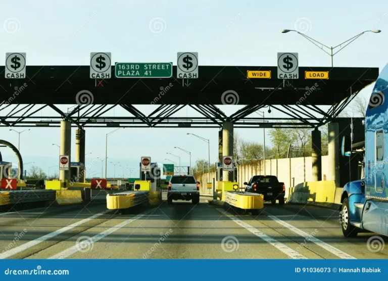 Illinois Tollway toll plaza with I-PASS and pay-by-plate signs