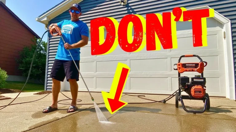jet washing a driveway with detergent