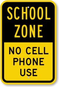 Kansas handheld cell phone ban sign in school zone