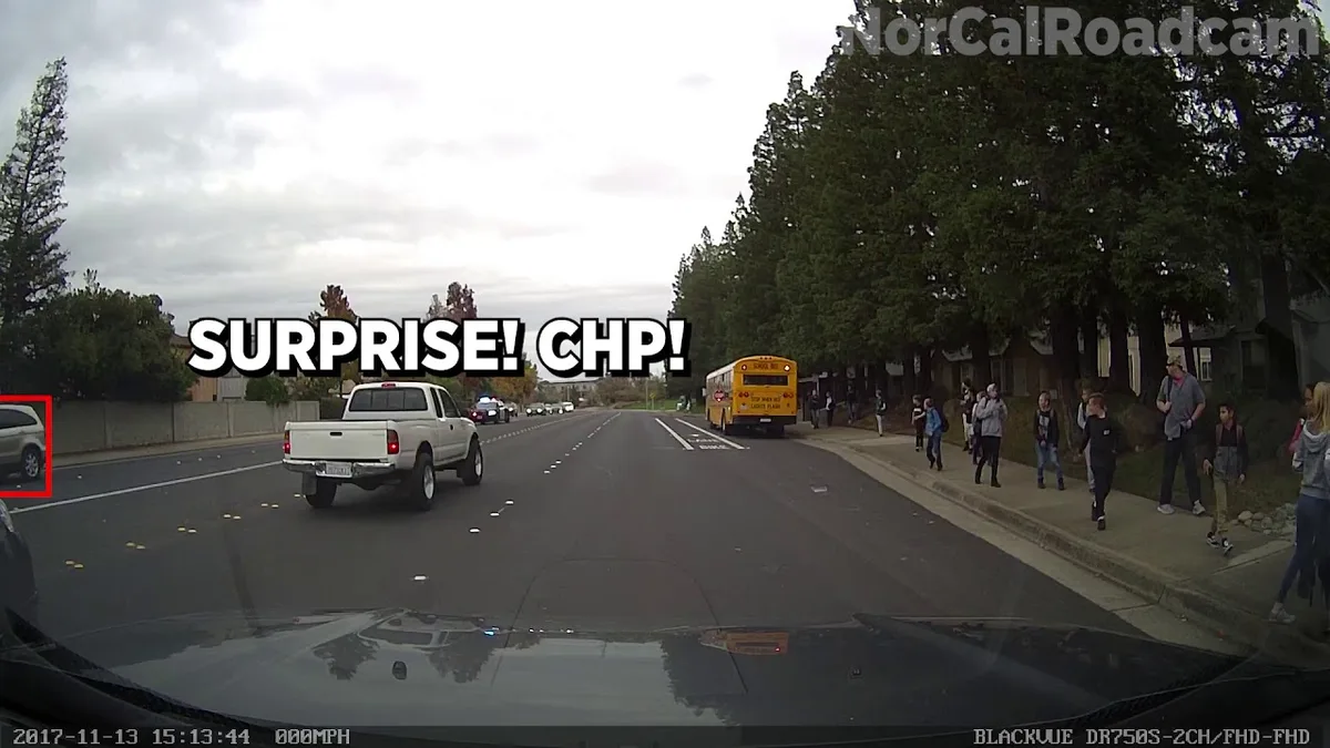 Louisiana school bus with flashing red lights and extended stop arm