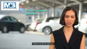 Massachusetts disabled parking permit hanging in car