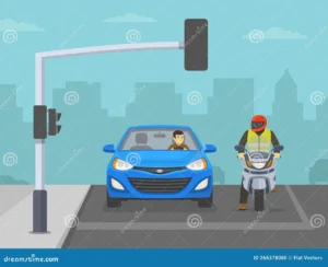 motorcyclist at red light intersection