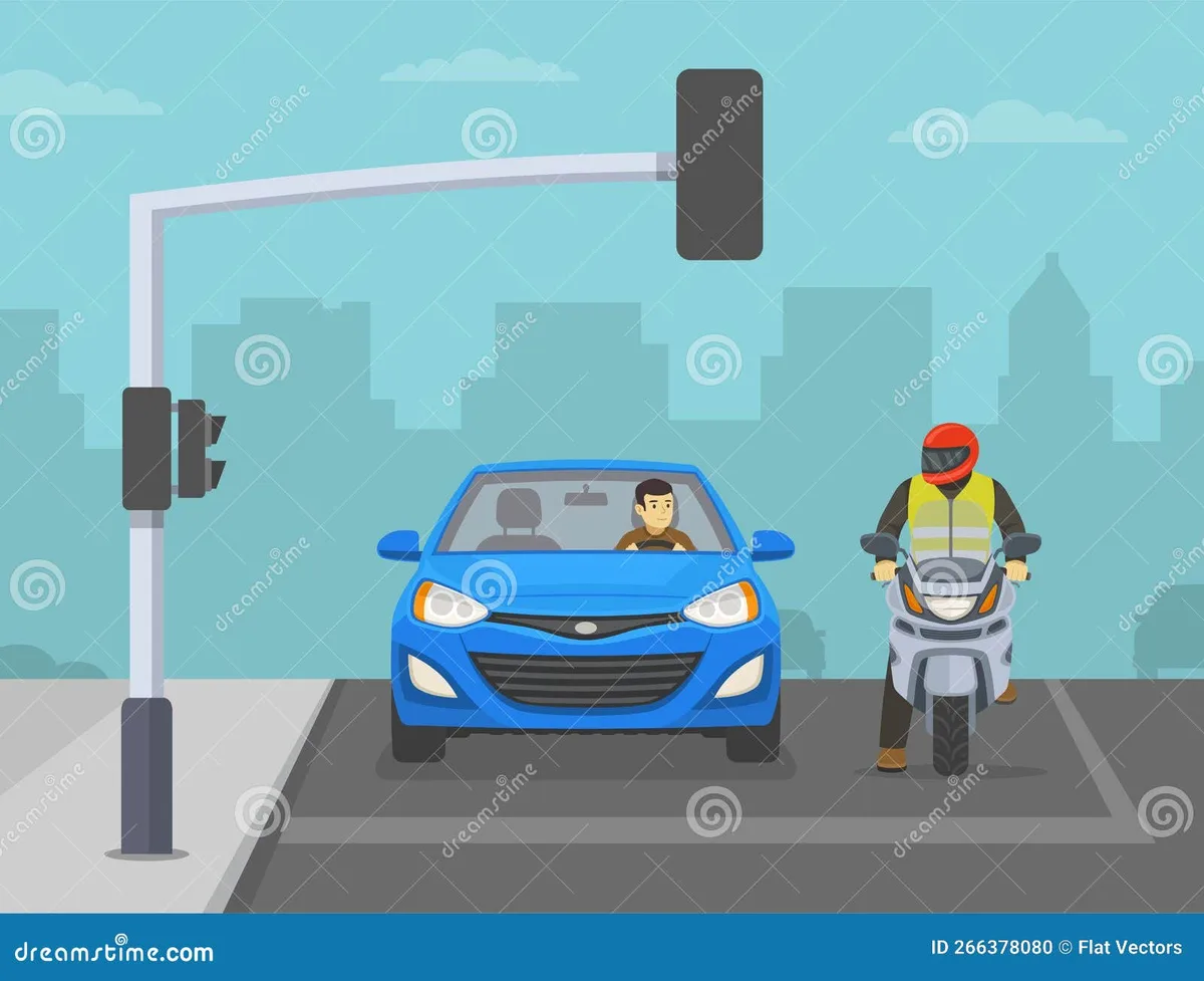 motorcyclist at red light intersection