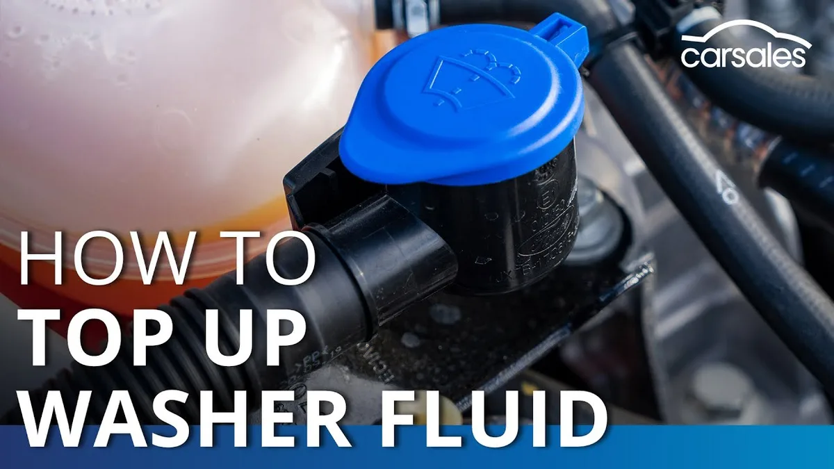 pouring windshield washer fluid