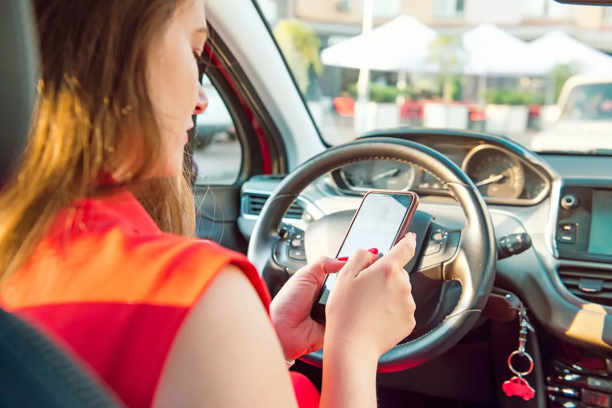 reading a text at a red light