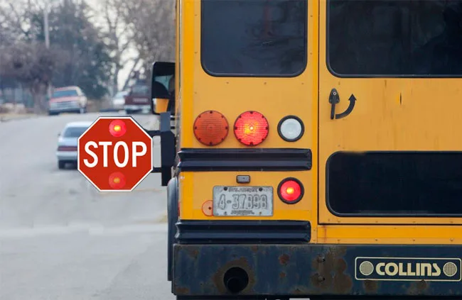 school bus flashing red lights stop arm extended