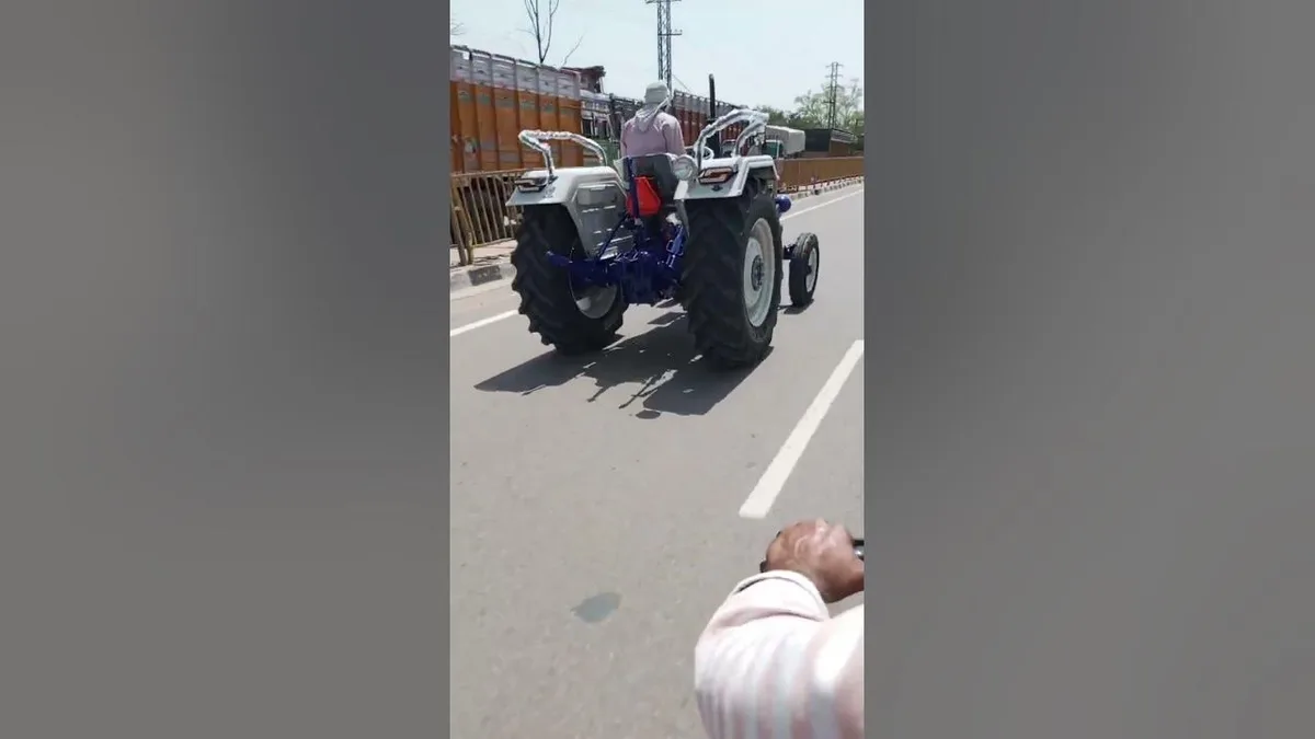 tractor with pilot car on two-lane road