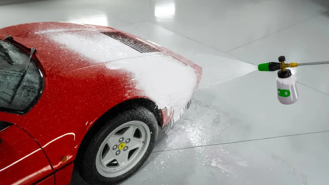washing BMW wheels with foam cannon