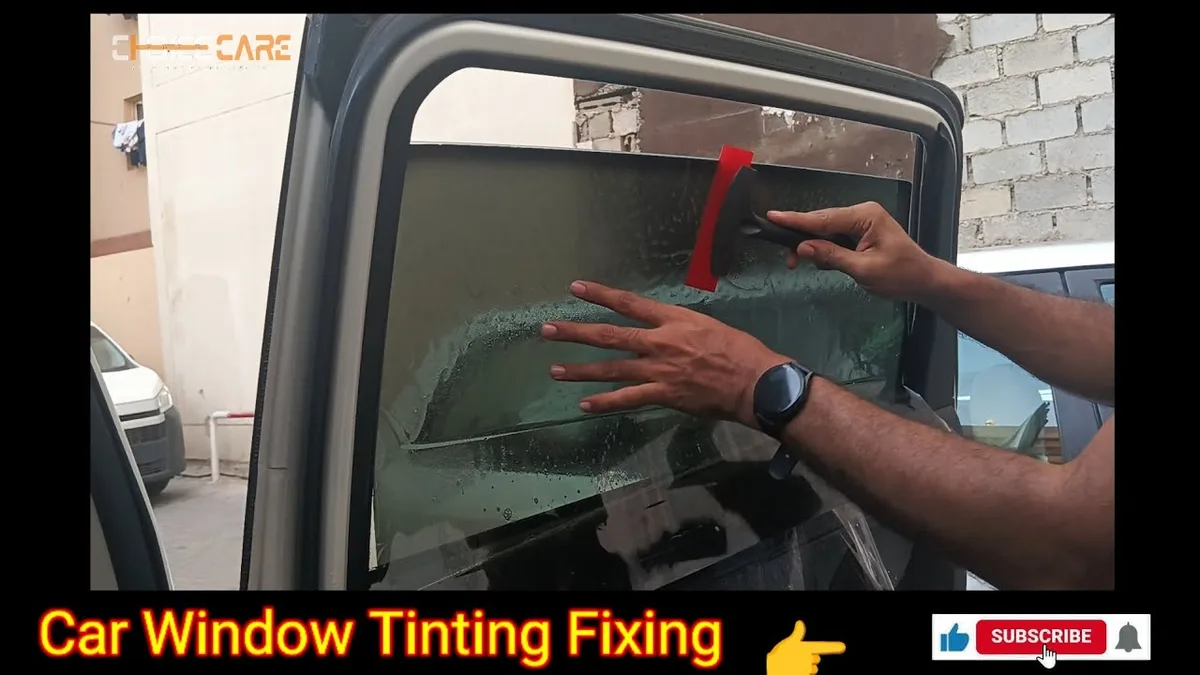 auto tint installer applying ceramic film