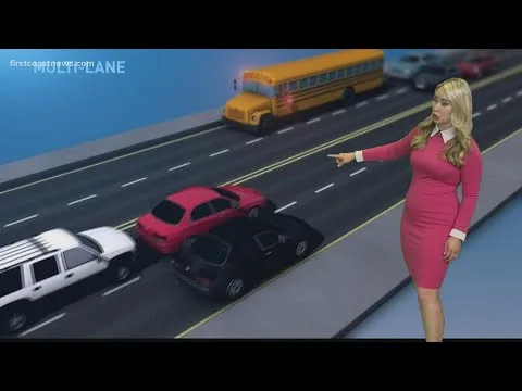 cars stopping for school bus on undivided road