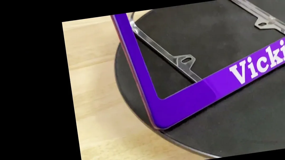 Compliant license plate frame materials