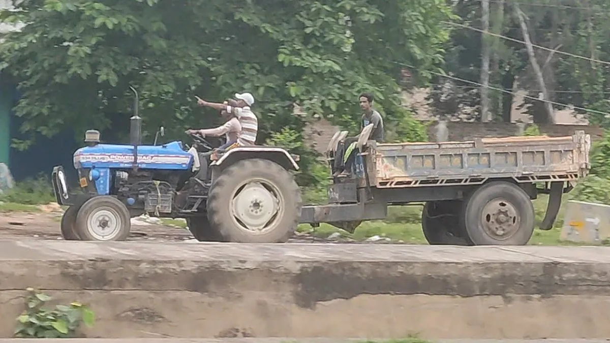 moving tractor between fields highway