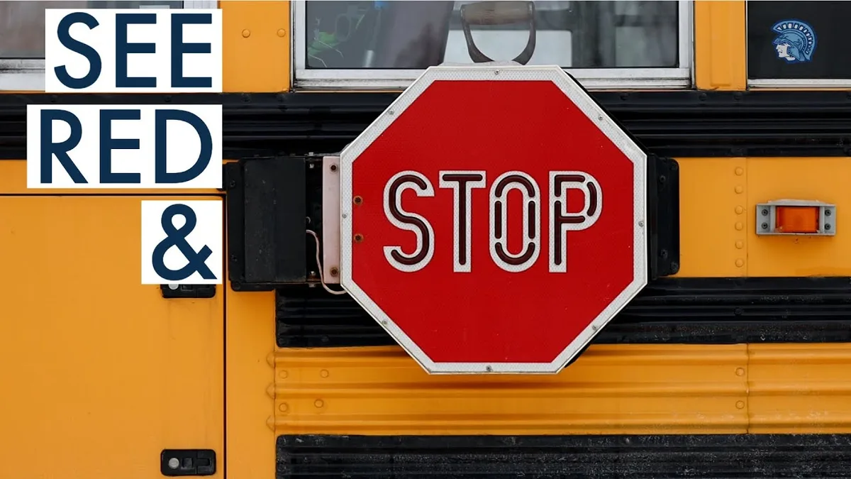 school bus stop arm flashing red lights